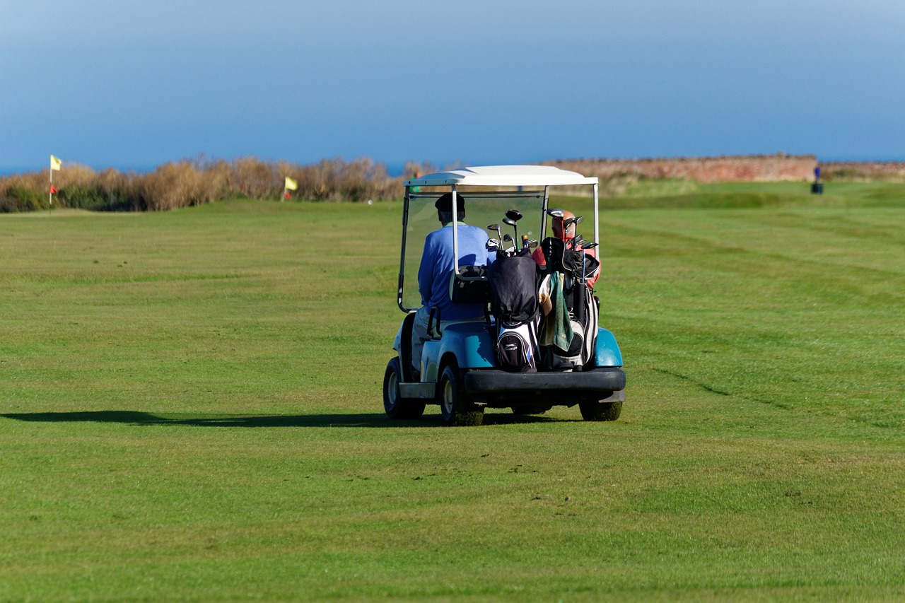 man on golf cart